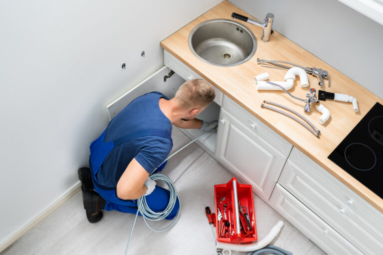 Drain Rooter Edmonton technician performing expert drain cleaning service.